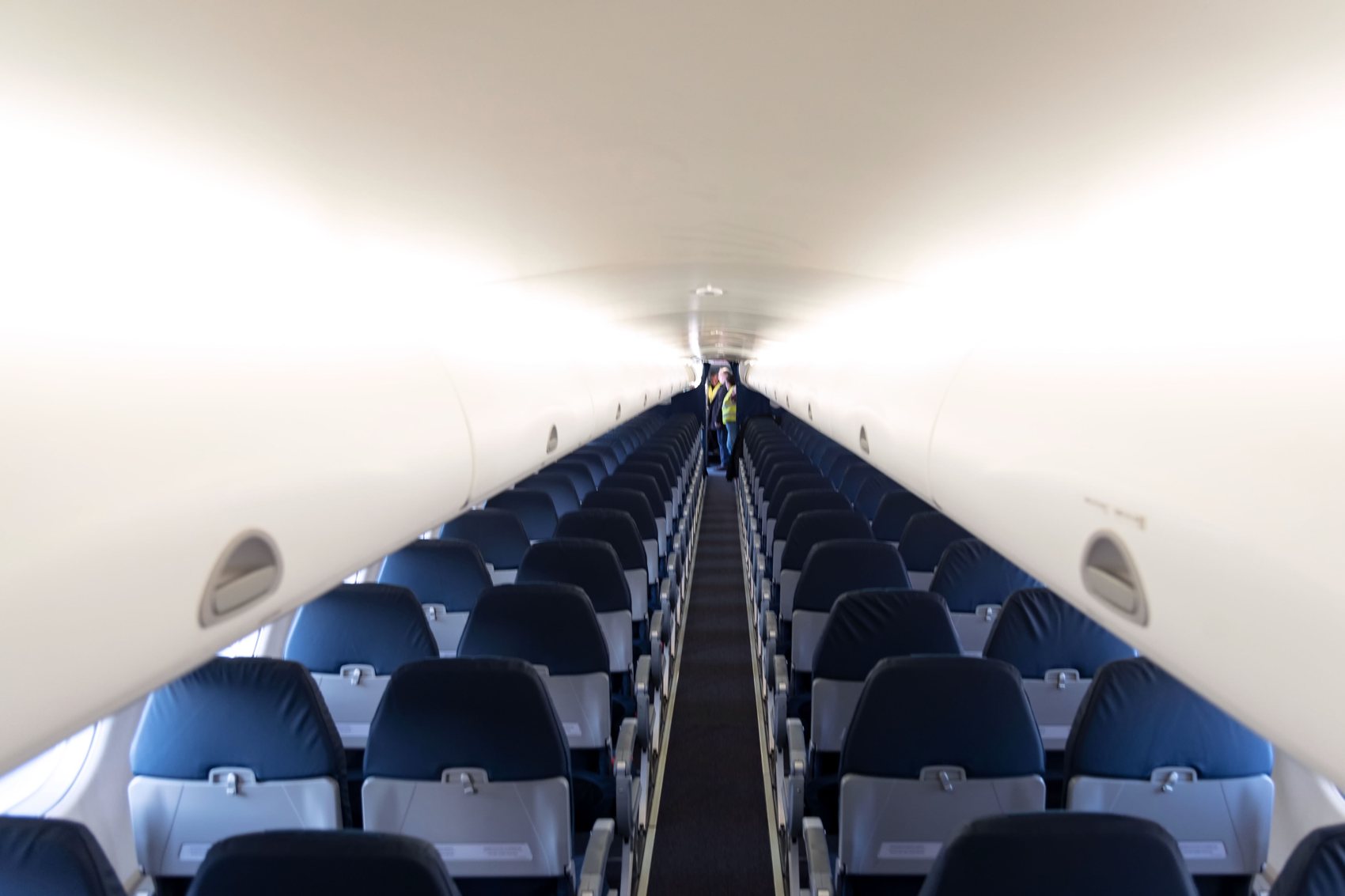 The two-by-two cabin aisle of a Marathon Airlines Embraer E-Jet